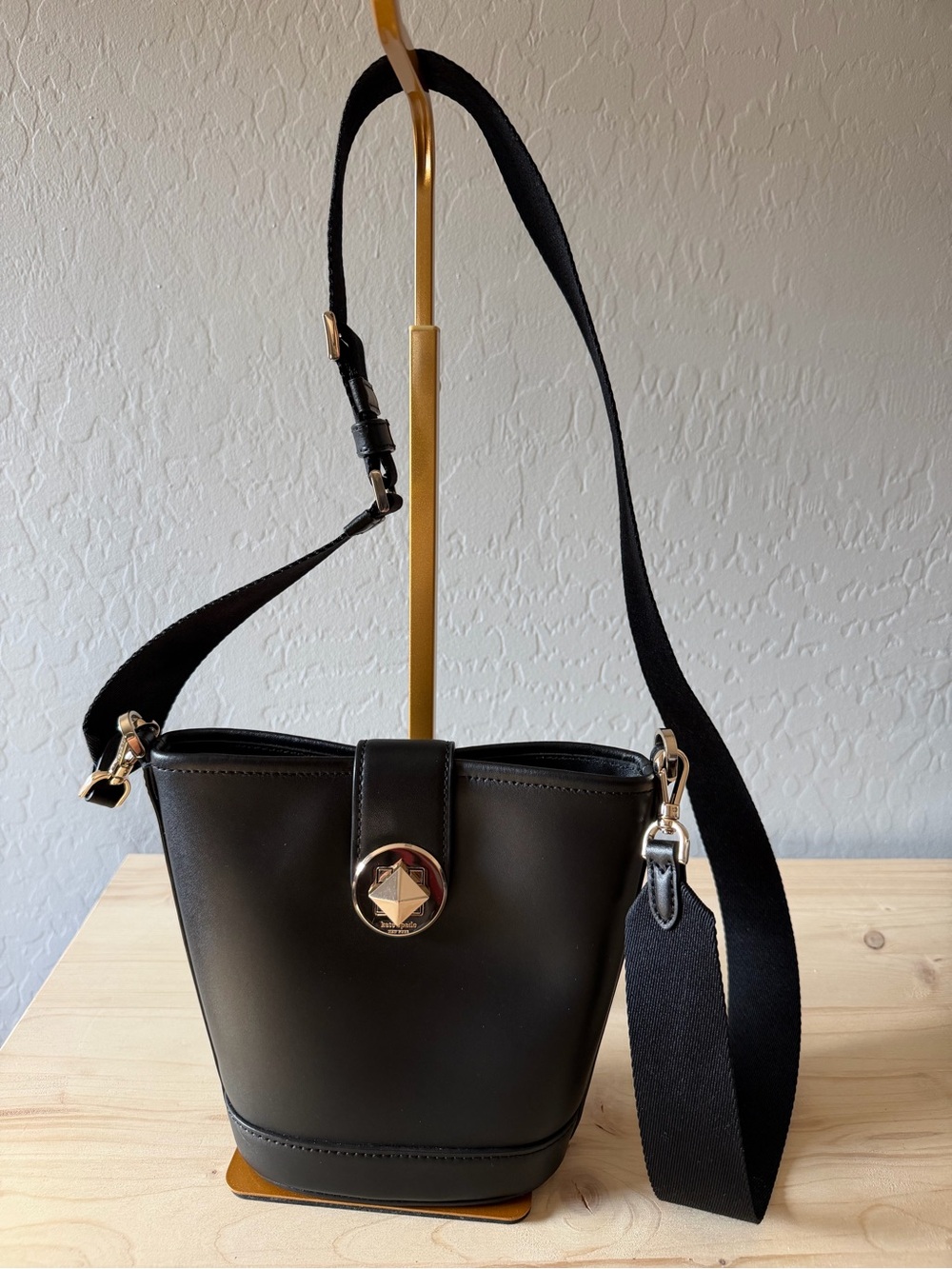 kate spade Black Leather Bucket Crossbody with Gold Medallion